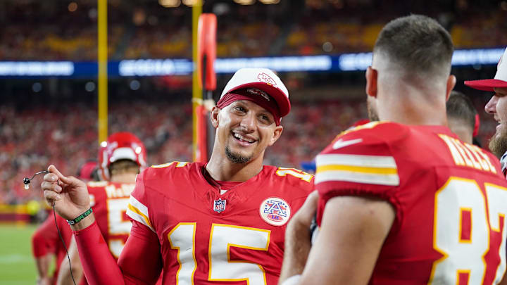 Aug 22, 2025; Kansas City, Missouri, USA; Kansas City Chiefs quarterback Patrick Mahomes (15) talks with tight end Travis Kelce (87) on  the sidelines against the Chicago Bears during the first half of the game at GEHA Field at Arrowhead Stadium. Mandatory Credit: Denny Medley-Imagn Images
