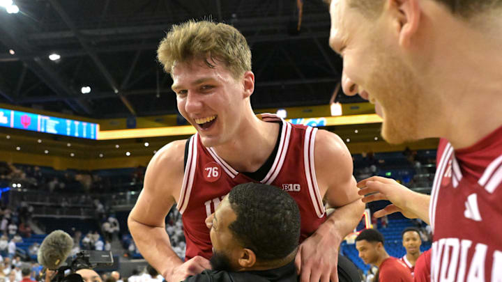 Jan 31, 2026; Los Angeles, California, USA;  Indiana Hoosiers forward Trent Sisley (11) celebrates with assistant coach Rod Clark after defeating the UCLA Bruins in double overtime at Pauley Pavilion presented by Wescom Financial.