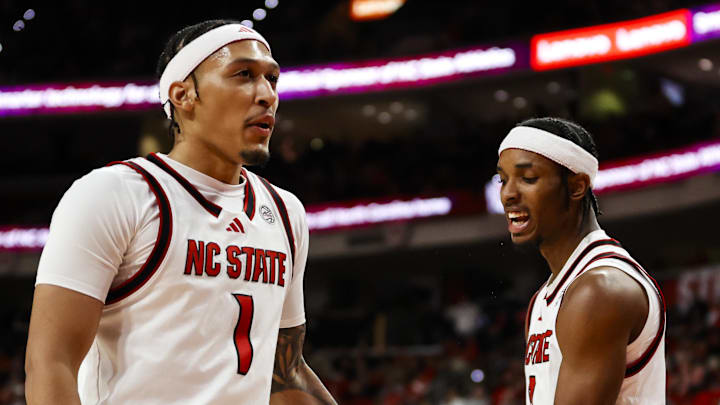 Jan 27, 2026; Raleigh, North Carolina, USA; NC State Wolfpack guard Jr. Paul McNeil (2) celebrates a  3-pointer with forward Darrion Williams (1) during the first half of the game against the Syracuse Orange at Lenovo Center. Mandatory Credit: Jaylynn Nash-Imagn Images