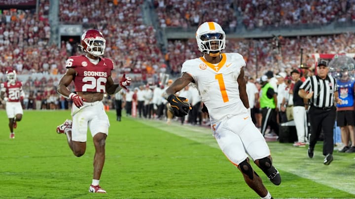 Tennessee Volunteers wide receiver Dont'e Thornton Jr. (1) scores a touchdown in front of Oklahoma Sooners defensive back Kani Walker (26) during a college football game between the University of Oklahoma Sooners (OU) and the Tennessee Volunteers at Gaylord Family - Oklahoma Memorial Stadium in Norman, Okla., Saturday, Sept. 21, 2024. Tennessee Volunteers wide receiver Dont'e Thornton Jr. (1) scores a touchdown in front of Oklahoma Sooners defensive back Kani Walker (26) during a college football game between the University of Oklahoma Sooners (OU) and the Tennessee Volunteers at Gaylord Family - Oklahoma Memorial Stadium in Norman, Okla., Saturday, Sept. 21, 2024.