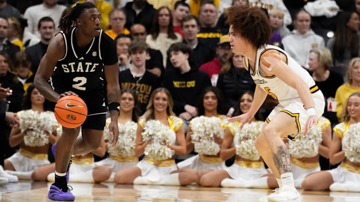 Jan 31, 2026; Columbia, Missouri, USA; Mississippi State Bulldogs guard Ja'borri McGhee (2) dribbles the ball as Missouri Tigers guard T.O. Barrett (5) defends during the first half of the game at Mizzou Arena. Mandatory 