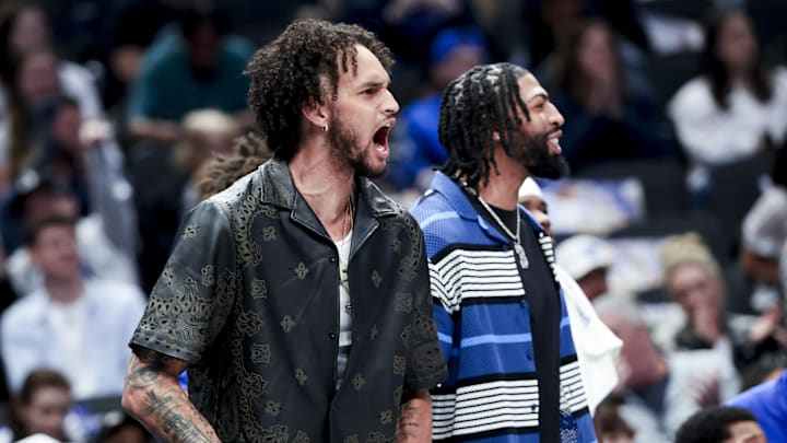 Feb 27, 2025; Dallas, Texas, USA;  Dallas Mavericks center Dereck Lively II (2) and Dallas Mavericks forward Anthony Davis (3) react on the bench against the Charlotte Hornets during the first half at American Airlines Center. Mandatory Credit: Kevin Jairaj-Imagn Images