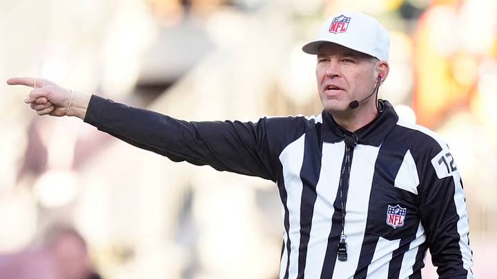 National Football League referee Brad Rogers (126) calls a penally during first half of Packers game against Broncos National Football League referee Brad Rogers (126) calls a penally during first half of Packers game against Broncos