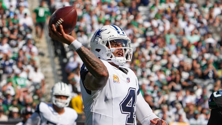 Dallas Cowboys quarterback Dak Prescott (4) looks to pass downfield as New York Jets defensive tackle Quinnen Williams (95) defends during the first half at MetLife Stadium.
