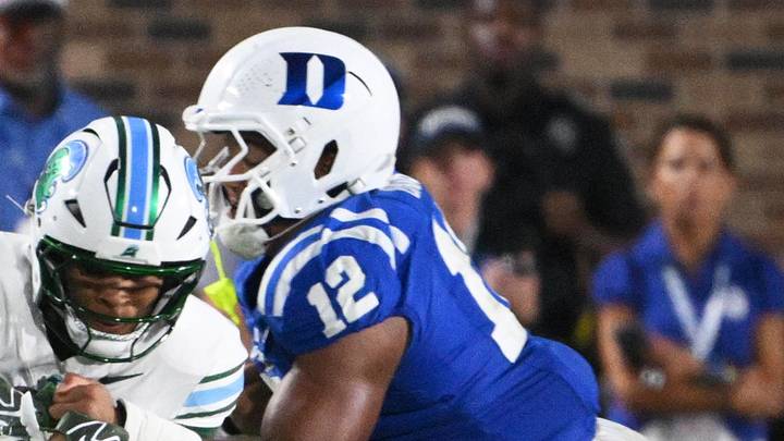 Sep 5, 2026; Durham, North Carolina, USA; Tulane Green Wave linebacker Chris Rodgers (4) is tackled by Duke Blue Devils linebacker Luke Mergott (34) and Duke Blue Devils defensive end Bryce Davis (12) at Wallace Wade Stadium. Mandatory Credit: Zachary Taft-Imagn Images Sep 5, 2026; Durham, North Carolina, USA; Tulane Green Wave linebacker Chris Rodgers (4) is tackled by Duke Blue Devils linebacker Luke Mergott (34) and Duke Blue Devils defensive end Bryce Davis (12) at Wallace Wade Stadium. Mandatory Credit: Zachary Taft-Imagn Images