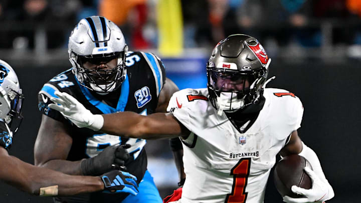 Tampa Bay Buccaneers running back Rachaad White runs as Carolina Panthers safety Jordan Fuller. Tampa Bay Buccaneers running back Rachaad White runs as Carolina Panthers safety Jordan Fuller.