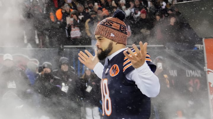 Chicago Bears quarterback Caleb Williams (18) runs onto the field during player introductions.