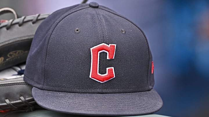 Jun 27, 2024; Kansas City, Missouri, USA; A general view a Cleveland Guardians hat and glove on the dugout railing before a game against the Kansas City Royals at Kauffman Stadium. Jun 27, 2024; Kansas City, Missouri, USA; A general view a Cleveland Guardians hat and glove on the dugout railing before a game against the Kansas City Royals at Kauffman Stadium.