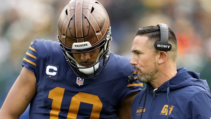Green Bay Packers coach Matt LaFleur talks to quarterback Jordan Love during the second half against the Carolina Panthers. Green Bay Packers coach Matt LaFleur talks to quarterback Jordan Love during the second half against the Carolina Panthers.