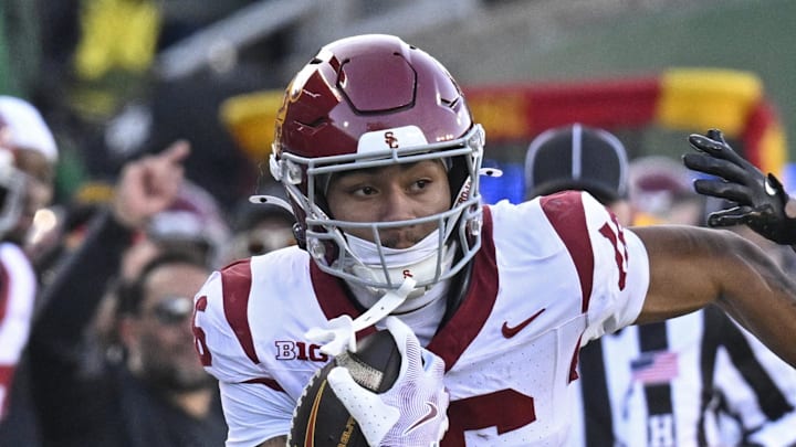 Nov 22, 2025; Eugene, Oregon, USA; Southern California Trojans wide receiver Tanook Hines (16) runs with the ball during the first half against the Oregon Ducks at Autzen Stadium. Mandatory Credit: Troy Wayrynen-Imagn Images