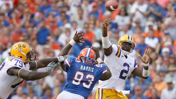 Oct 7, 2006; Gainesville, FL, USA; Louisiana State Tigers quarterback (2) JaMarcus Russell throws as he is pressured by Florida Gators defensive tackle (93) Steven Harris during the 3rd quarter at Ben Hill Griffin Stadium in Gainesville, Florida. The Gators defeated the Tigers 23-10. Mandatory Credit: Jason Parkhurst-Imagn Images Copyright © 2006 Jason Parkhurst