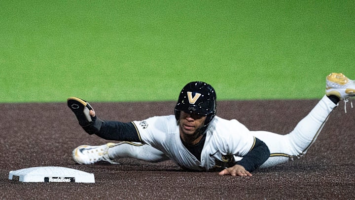 Vanderbilt Commodores RJ Hamilton (2) slides safely into second base for a steal against the Air Force Falcons at Hawkins Field in Nashville, Tenn., Monday, Feb. 17, 2025. The Commodores beat the Falcons 3-1.