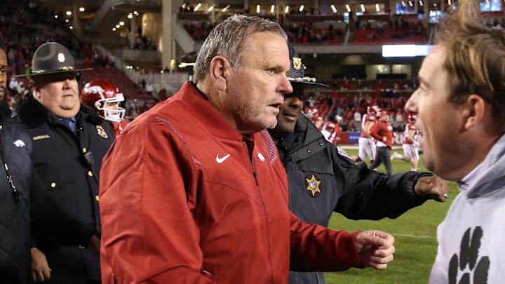 Arkansas Razorbacks coach Sam Pittman shakes hands with Missouri Tigers coach Eil Drinkwitz after the game at Donald W. Reynolds Razorbacks Stadium.
