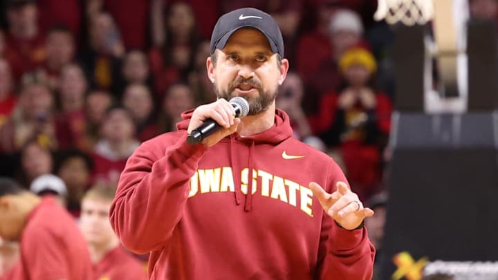 Dec 11, 2025; Ames, Iowa, USA; Iowa State Cyclones new football coach Jimmy Rogers speaks during the Cyclones game with the Iowa Hawkeyes during the first half at James H. Hilton Coliseum. Dec 11, 2025; Ames, Iowa, USA; Iowa State Cyclones new football coach Jimmy Rogers speaks during the Cyclones game with the Iowa Hawkeyes during the first half at James H. Hilton Coliseum.