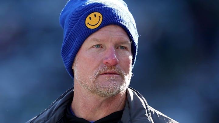 Dec 22, 2024; East Rutherford, New Jersey, USA; Los Angeles Rams general manager Les Snead watches his team warm up before a game against the New York Jets at MetLife Stadium. Mandatory Credit: Brad Penner-Imagn Images