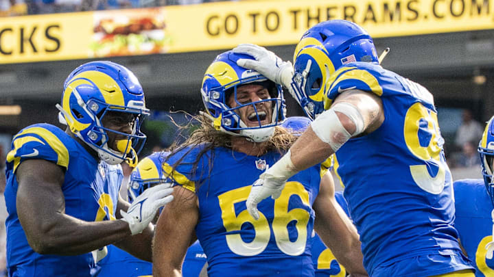 October 15, 2023; Inglewood, California, USA; Los Angeles Rams linebacker Christian Rozeboom (56) is congratulated after intercepting the football during the fourth quarter against the Arizona Cardinals at SoFi Stadium. Mandatory Credit: Kyle Terada-Imagn Images