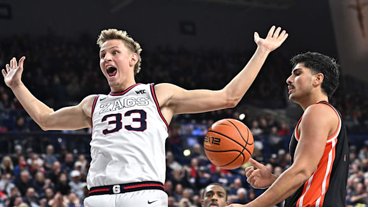 Jan 28, 2025; Spokane, Washington, USA; Gonzaga Bulldogs forward Ben Gregg (33) celebrates after a dunk against Oregon State Beavers forward Michael Rataj (12) in the second half at McCarthey Athletic Center. Mandatory Credit: James Snook-Imagn Images