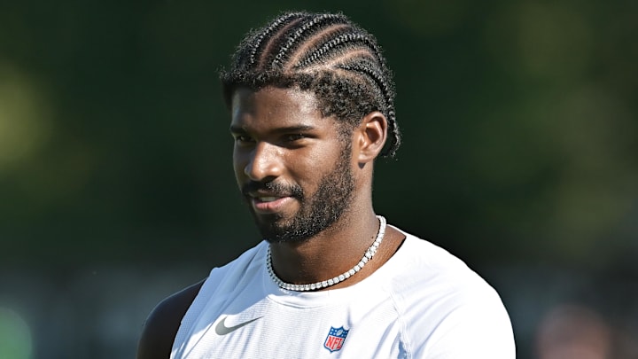 Jul 23, 2025; Berea, OH, USA; Cleveland Browns quarterback Shedeur Sanders (12) walks off the field during training camp at CrossCountry Mortgage Campus. Mandatory Credit: Ken Blaze-Imagn Images