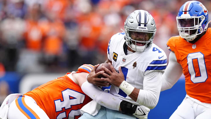 Denver Broncos linebacker Alex Singleton tackles Dallas Cowboys quarterback Dak Prescott Denver Broncos linebacker Alex Singleton tackles Dallas Cowboys quarterback Dak Prescott