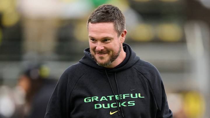 Oct 25, 2025; Eugene, Oregon, USA; Oregon Ducks head coach Dan Lanning encourages players during warm ups before a game against the Wisconsin Badgers at Autzen Stadium. The Ducks are wearing uniforms celebrating the Grateful Dead. Mandatory Credit: Troy Wayrynen-Imagn Images Oct 25, 2025; Eugene, Oregon, USA; Oregon Ducks head coach Dan Lanning encourages players during warm ups before a game against the Wisconsin Badgers at Autzen Stadium. The Ducks are wearing uniforms celebrating the Grateful Dead. Mandatory Credit: Troy Wayrynen-Imagn Images