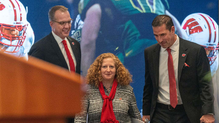 Wisconsin head football coach Luke Fickell, right, joins athletic director Chris McIntosh, left, and Chancellor Jennifer Mnookin at a welcome event Monday, November 28, 2022. at Camp Randall Stadium in Madison, Wis.