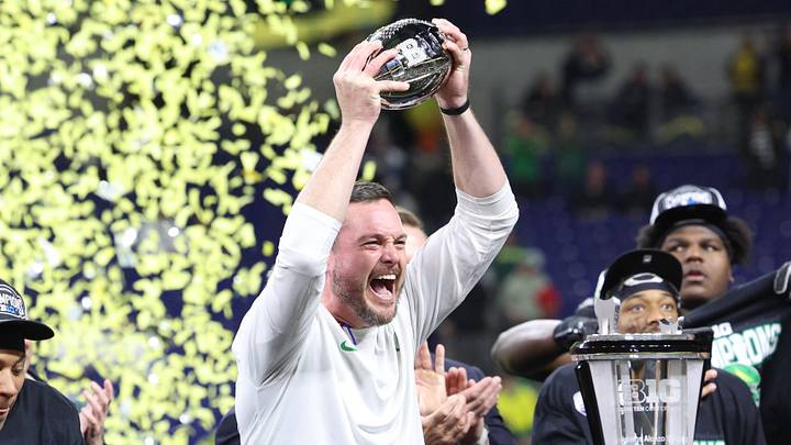 Dec 7, 2024; Indianapolis, IN, USA; Oregon Ducks head coach Dan Lanning and the Oregon Ducks celebrate defeating the Penn State Nittany Lions to win the Big Ten Championship in the 2024 Big Ten Championship game at Lucas Oil Stadium. Mandatory Credit: Jordan Prather-Imagn Images