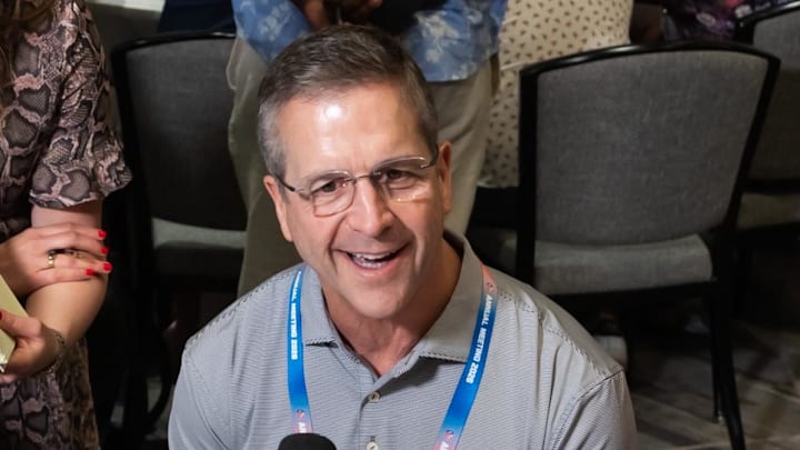 Mar 30, 2026; Phoenix, AZ, USA; New York Giants head coach John Harbaugh (center) speaks to reporters and the media during the 2026 NFL Annual League Meeting at the Arizona Biltmore.  
