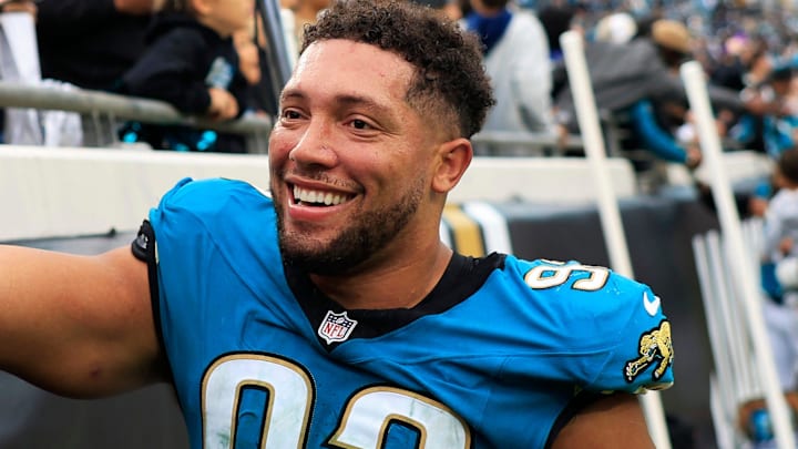 Jacksonville Jaguars defensive end Matt Dickerson (93) high-fives fans after the game of an NFL football matchup at EverBank Stadium, Sunday, Jan. 4, 2026, in Jacksonville, Fla. The Jaguars defeated the Titans 41-7, capturing the AFC South title. [Corey Perrine/Florida Times-Union]