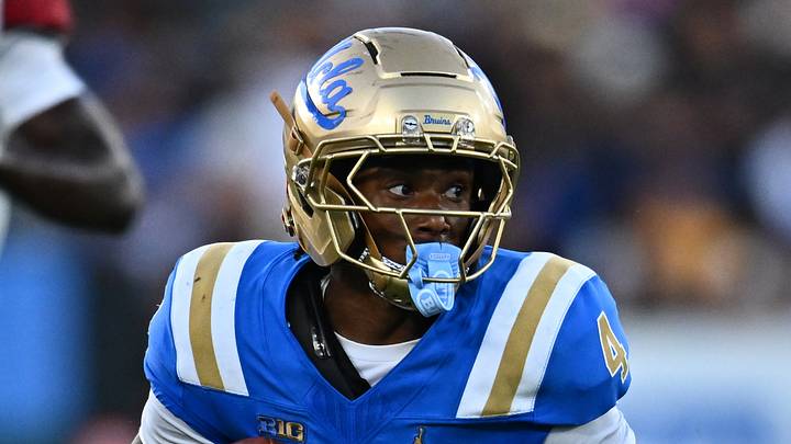 Sep 12, 2026; Pasadena, California, USA; UCLA wide receiver Semaj Morgan (4) runs with the ball after making a catch while under pressure from San Diego State safety Jelani McLaughlin (20) during the second half at the Rose Bowl. Mandatory Credit: William Liang-Imagn Images Sep 12, 2026; Pasadena, California, USA; UCLA wide receiver Semaj Morgan (4) runs with the ball after making a catch while under pressure from San Diego State safety Jelani McLaughlin (20) during the second half at the Rose Bowl. Mandatory Credit: William Liang-Imagn Images