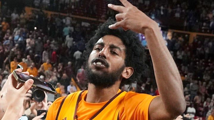 ASU Sun Devils guard Moe Odum (5) celebrates with fans after their 70-60 win over the Kansas Jayhawks at Desert Financial Arena in Tempe on March 3, 2026.