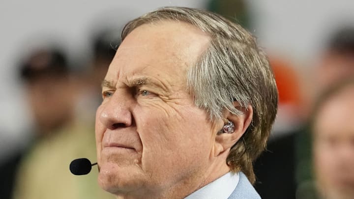 Jan 19, 2026; Miami Gardens, FL, USA; TV analyst Bill Belichick watches the Miami Hurricanes play the Indiana Hoosiers during the first half of the College Football Playoff National Championship game at Hard Rock Stadium. Mandatory Credit: Kirby Lee-Imagn Images