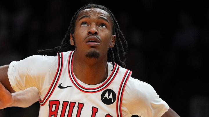 Jan 31, 2026; Miami, Florida, USA;  Chicago Bulls forward Julian Phillips (15) battles for a rebound with Miami Heat forward Simone Fontecchio (0) during the second half at Kaseya Center. Mandatory Credit: Jim Rassol-Imagn Images