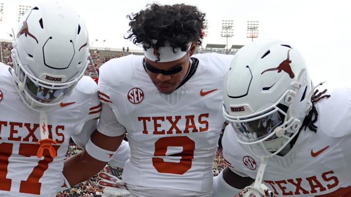 Oct 25, 2025; Starkville, Mississippi, USA; Texas Longhorns defensive backs Xavier Filsaime (17), Jonah Williams (9) and Jordon Johnson-Rubell (23) huddle up during warm ups prior to the game against the Mississippi State Bulldogs at Davis Wade Stadium at Scott Field. Mandatory Credit: Petre Thomas-Imagn Images