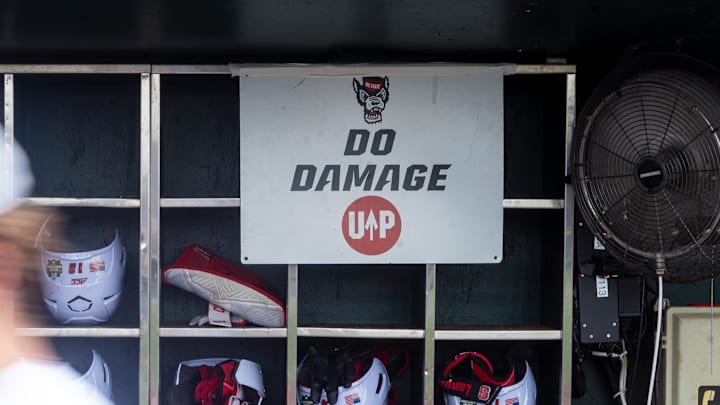 Jun 17, 2024; Omaha, NE, USA; NC State Wolfpack shortstop Brandon Butterworth (3) walks through the dugout before the game against the Florida Gators at Charles Schwab Field Omaha. Mandatory Credit: Dylan Widger-Imagn Images