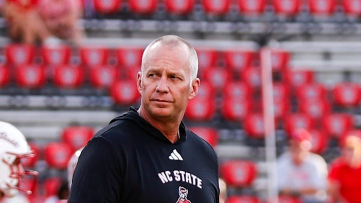 Aug 28, 2025; Raleigh, North Carolina, USA; North Carolina State Wolfpack head coach Dave Doeren walks among his players during the warmups prior to the game against East Carolina Pirates at Carter-Finley Stadium. Mandatory Credit: Jaylynn Nash-Imagn Images Aug 28, 2025; Raleigh, North Carolina, USA; North Carolina State Wolfpack head coach Dave Doeren walks among his players during the warmups prior to the game against East Carolina Pirates at Carter-Finley Stadium. Mandatory Credit: Jaylynn Nash-Imagn Images