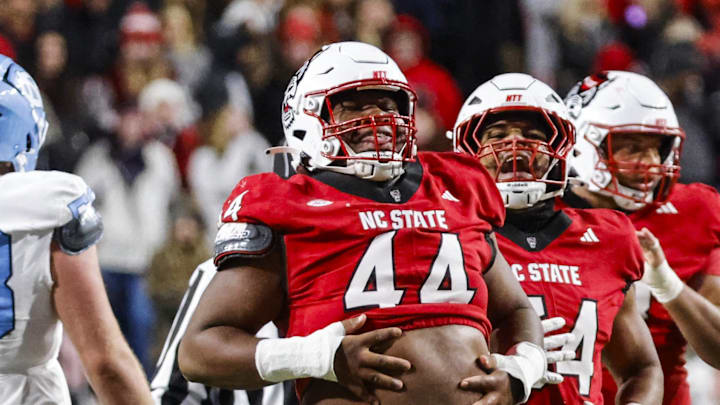 Nov 29, 2025; Raleigh, North Carolina, USA;  NC State Wolfpack defensive tackle Brandon Cleveland (44) reacts to his tackle during the first half of the game against North Carolina Tar Heels at Carter-Finley Stadium.  Mandatory Credit: Jaylynn Nash-Imagn Images