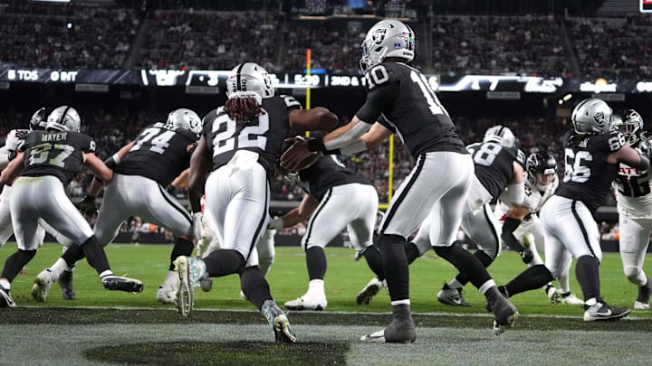 Dec 16, 2024; Paradise, Nevada, USA; A general overall view as Las Vegas Raiders quarterback Desmond Ridder (10) hands the ball off to running back Alexander Mattison (22) in the first half against the Atlanta Falcons at Allegiant Stadium. Mandatory Credit: Kirby Lee-Imagn Images