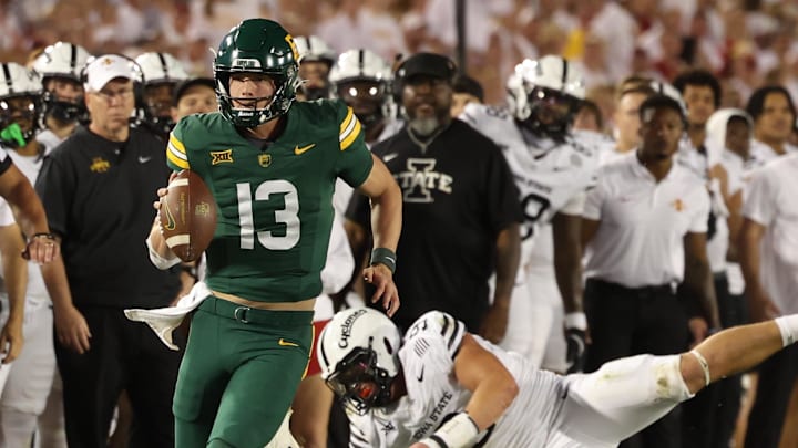 Oct 5, 2024; Ames, Iowa, USA; Baylor Bears quarterback Sawyer Robertson (13) runs for a first down against the Iowa State Cyclones at Jack Trice Stadium. The Cyclones beat the Bears 43 to 21.  Mandatory Credit: Reese Strickland-Imagn Images