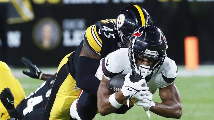 Aug 9, 2024; Pittsburgh, Pennsylvania, USA; Houston Texans wide receiver Johnny Johnson III (front) dives for additional yardage as Pittsburgh Steelers linebacker Jacoby Windmon (45) defends during the fourth quarter at Acrisure Stadium. Houston won 20-12. Mandatory Credit: Charles LeClaire-Imagn Images Aug 9, 2024; Pittsburgh, Pennsylvania, USA; Houston Texans wide receiver Johnny Johnson III (front) dives for additional yardage as Pittsburgh Steelers linebacker Jacoby Windmon (45) defends during the fourth quarter at Acrisure Stadium. Houston won 20-12. Mandatory Credit: Charles LeClaire-Imagn Images
