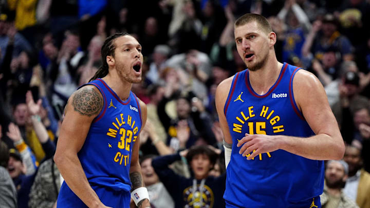 Jan 23, 2025; Denver, Colorado, USA; Denver Nuggets center Nikola Jokic (15) reacts along side forward Aaron Gordon (32)  following a full court basket made in the second half against the Sacramento Kings at Ball Arena. Mandatory Credit: Ron Chenoy-Imagn Images