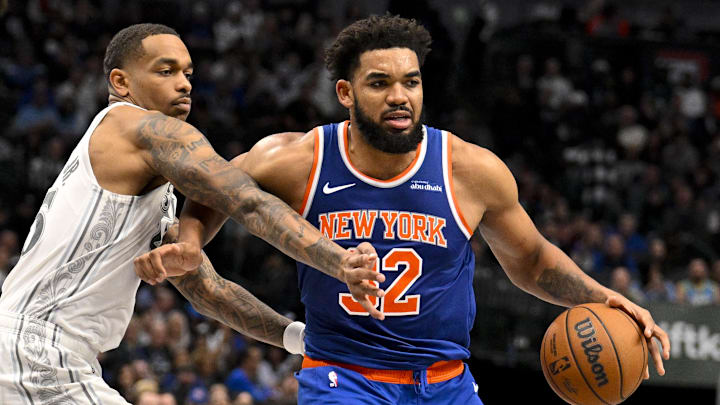 Nov 27, 2024; Dallas, Texas, USA; Dallas Mavericks forward P.J. Washington (25) and New York Knicks center Karl-Anthony Towns (32) in action during the game between the Dallas Mavericks and the New York Knicks at the American Airlines Center. Mandatory Credit: Jerome Miron-Imagn Images