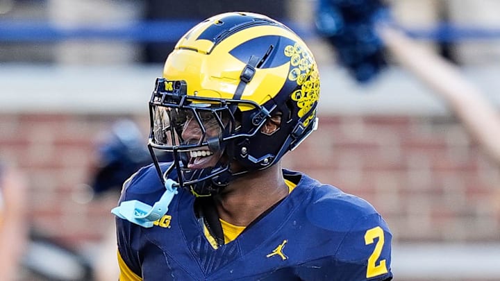 Michigan defensive back Will Johnson celebrates a touchdown after intercepting USC quarterback Miller Moss during the second half at Michigan Stadium in Ann Arbor on Saturday, Sept. 21, 2024.