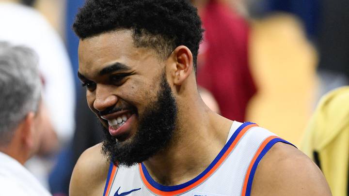 May 23, 2026; Cleveland, Ohio, USA; New York Knicks center Karl-Anthony Towns (32)  high fives teammates after defeating the Cleveland Cavaliers in game three of the eastern conference finals for the 2026 NBA playoffs at Rocket Arena. Mandatory Credit: David Richard-Imagn Images