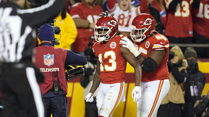 Jan 23, 2022; Kansas City, Missouri, USA; Kansas City Chiefs wide receiver Byron Pringle (13) celebrates his touchdown with Kansas City Chiefs guard Trey Smith (65) during the first half in the AFC Divisional playoff football game against the Buffalo Bills at GEHA Field at Arrowhead Stadium. Mandatory Credit: Jay Biggerstaff-Imagn Images