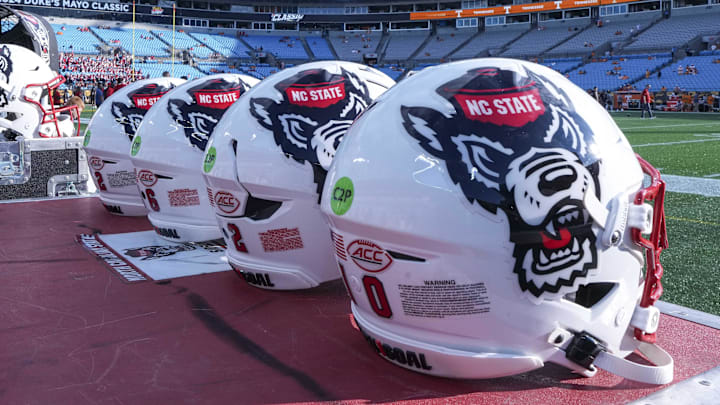 Sep 7, 2024; Charlotte, North Carolina, USA; North Carolina State Wolfpack helmets during pregame activity for the Dukes Mayo Classic against the Tennessee Volunteers at Bank of America Stadium. Mandatory Credit: Jim Dedmon-Imagn Images