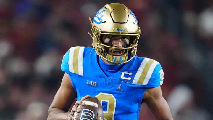 Nov 29, 2025; Los Angeles, California, USA; UCLA Bruins quarterback Nico Iamaleava (9) carries the ball against the Southern California Trojans in the first half at United Airlines Field at Los Angeles Memorial Coliseum. Mandatory Credit: Kirby Lee-Imagn Images Nov 29, 2025; Los Angeles, California, USA; UCLA Bruins quarterback Nico Iamaleava (9) carries the ball against the Southern California Trojans in the first half at United Airlines Field at Los Angeles Memorial Coliseum. Mandatory Credit: Kirby Lee-Imagn Images