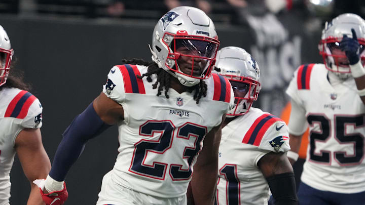 Dec 18, 2022; Paradise, Nevada, USA; New England Patriots safety Kyle Dugger (23) celebrates with linebacker Jahlani Tavai (48) after scoring on an 18-yard interception return against the Las Vegas Raiders in the third quarter at Allegiant Stadium. The Raiders defeated the Patriots 30-24. Mandatory Credit: Kirby Lee-Imagn Images