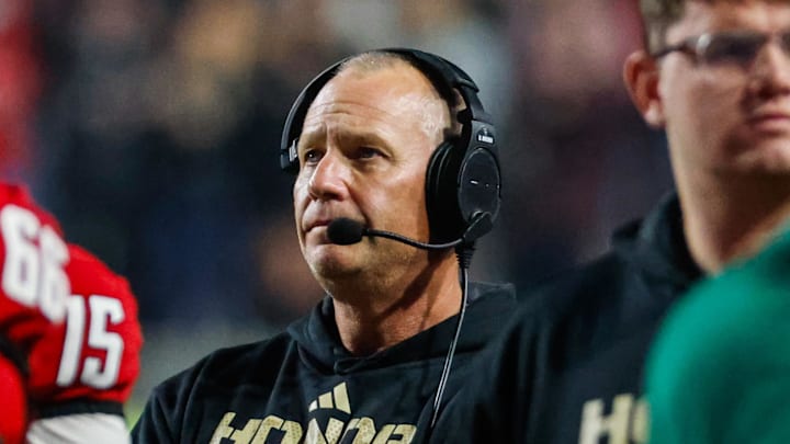 Nov 21, 2025; Raleigh, North Carolina, USA;  NC State Wolfpack head coach Dave Doeren looks on during the second half of the game against Florida State Seminoles at Carter-Finley Stadium. Mandatory Credit: Jaylynn Nash-Imagn Images