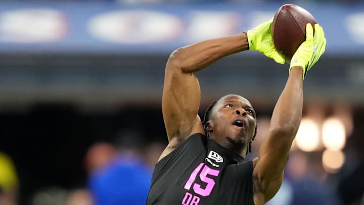 Ohio State cornerback Davison Igbinosun catches a pass at the Scouting Combine.
