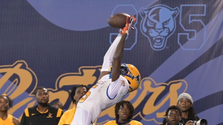 Miami Northwestern's Calvin Russell Jr. leaps for a tough catch attempt during the first half of the Class 3A state championship on Dec. 14, 2024. Miami Northwestern's Calvin Russell Jr. leaps for a tough catch attempt during the first half of the Class 3A state championship on Dec. 14, 2024.